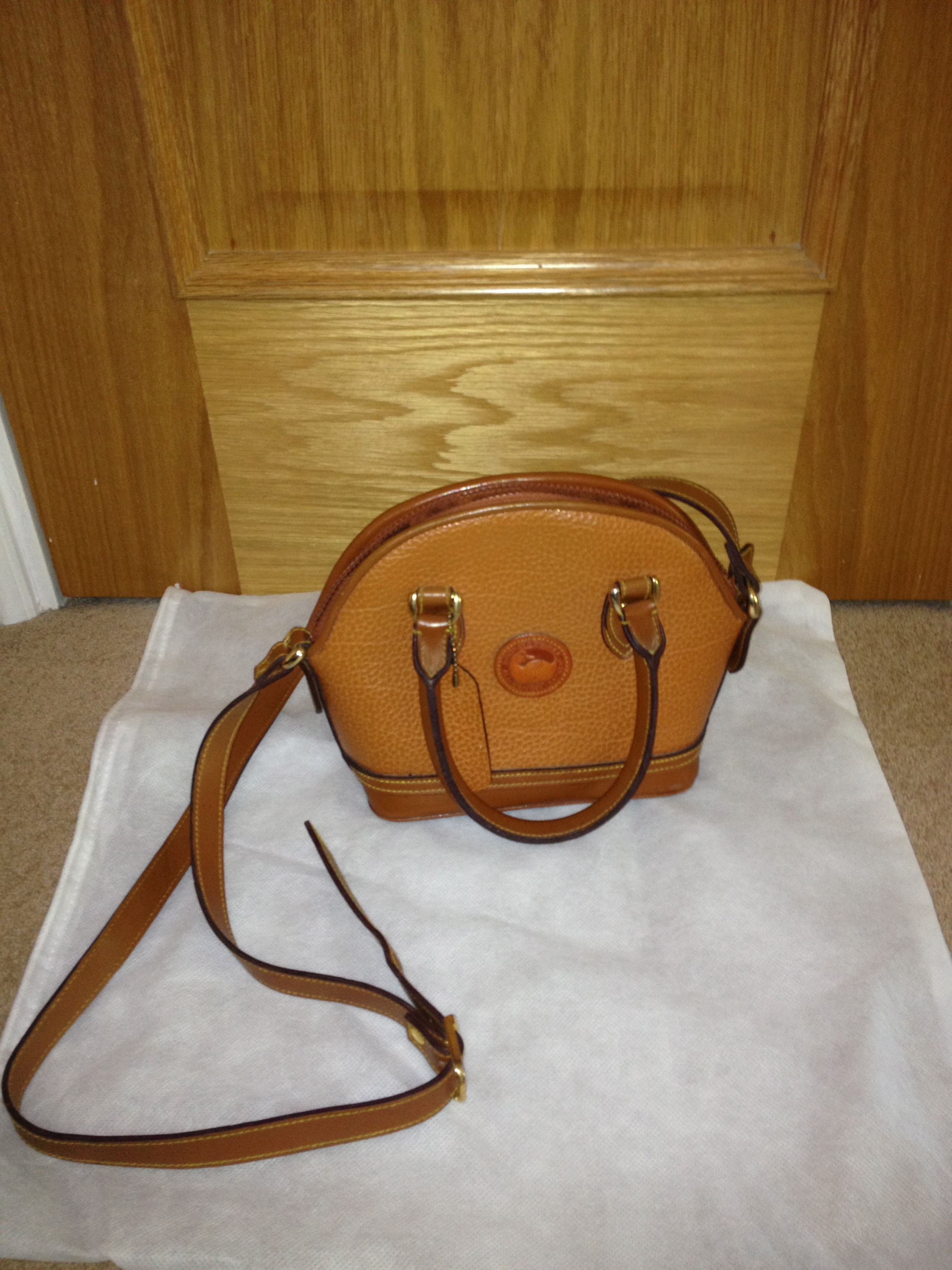 I bought this Dooney & Bourke bag at a thrift store – how much is it worth?